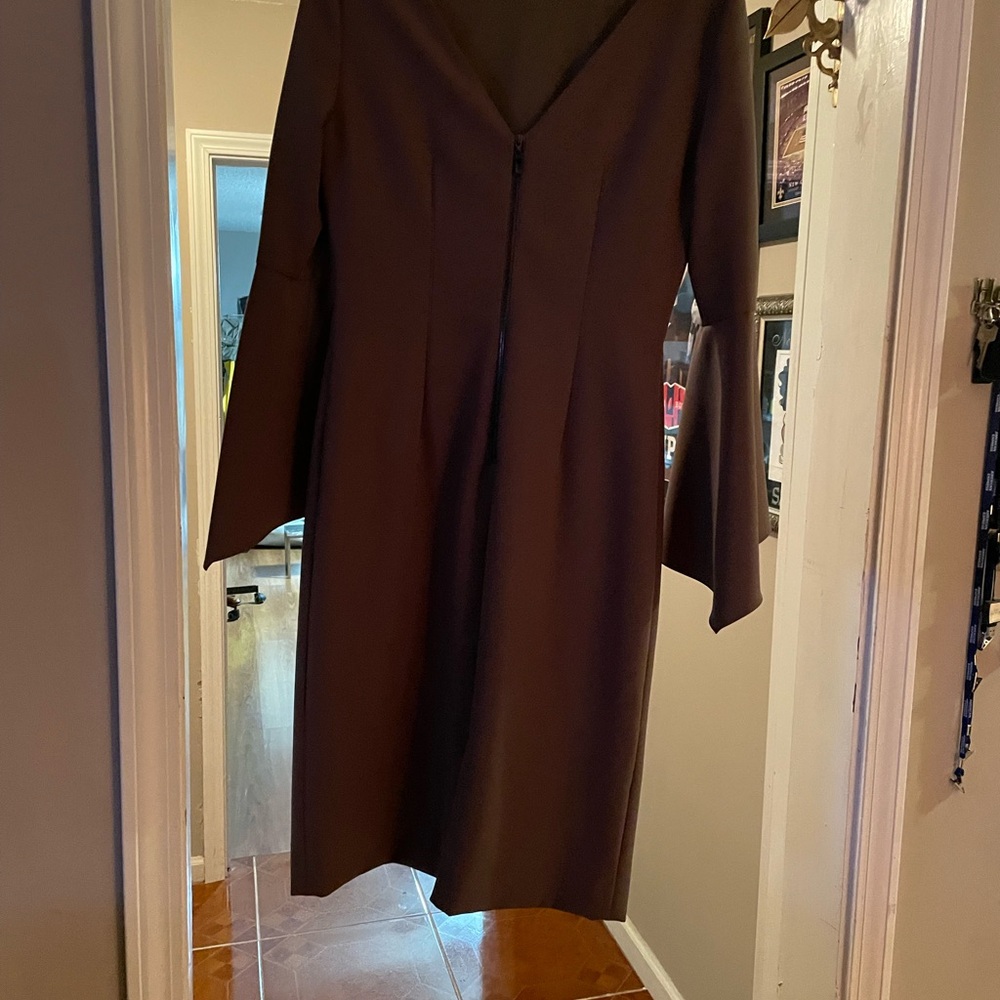 This dress is simply gorgeous it’s knee length maybe slightly above.